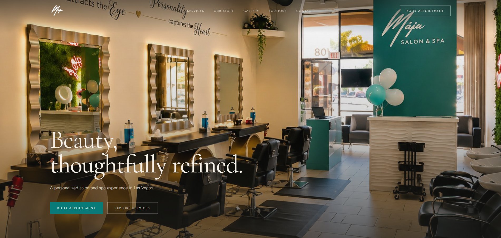The redesigned Maja Salon & Spa homepage: the salon&rsquo;s own interior photography behind the line &lsquo;Beauty, thoughtfully refined.&rsquo;